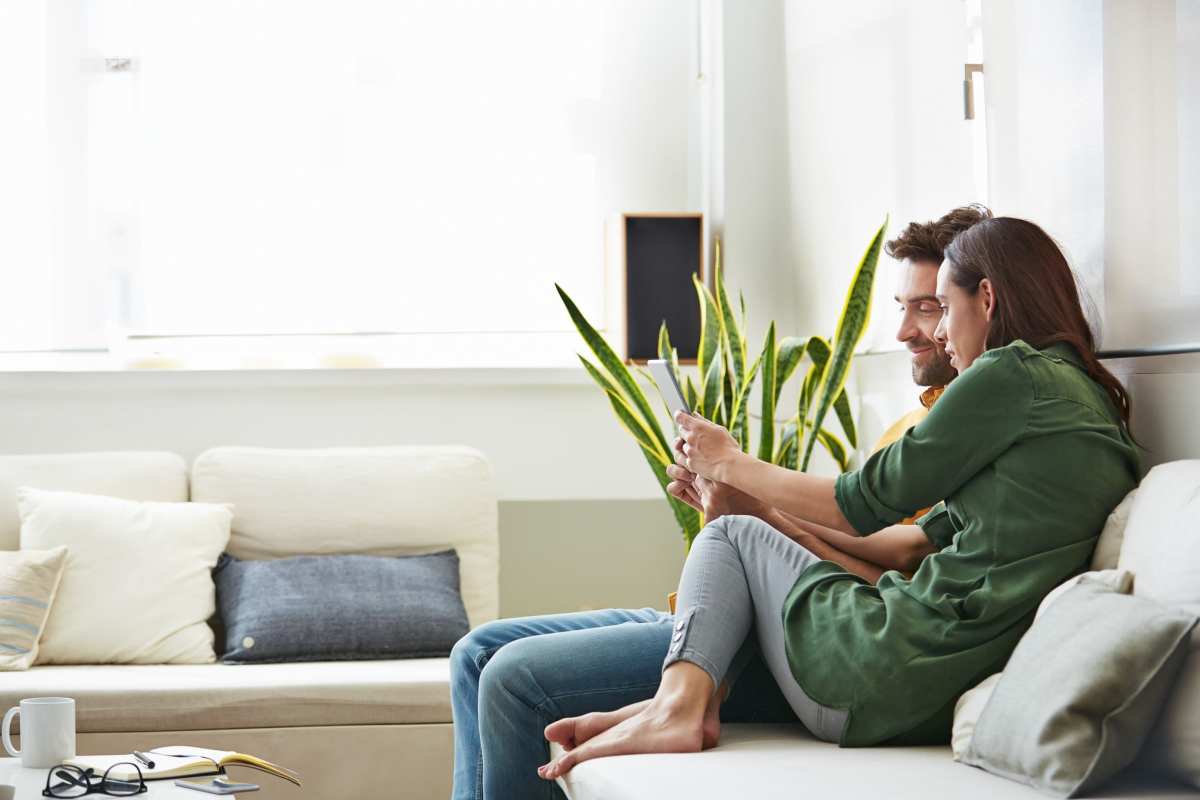Resident couple relaxing in their home at Eclipse on Broad in Athens, Georgia