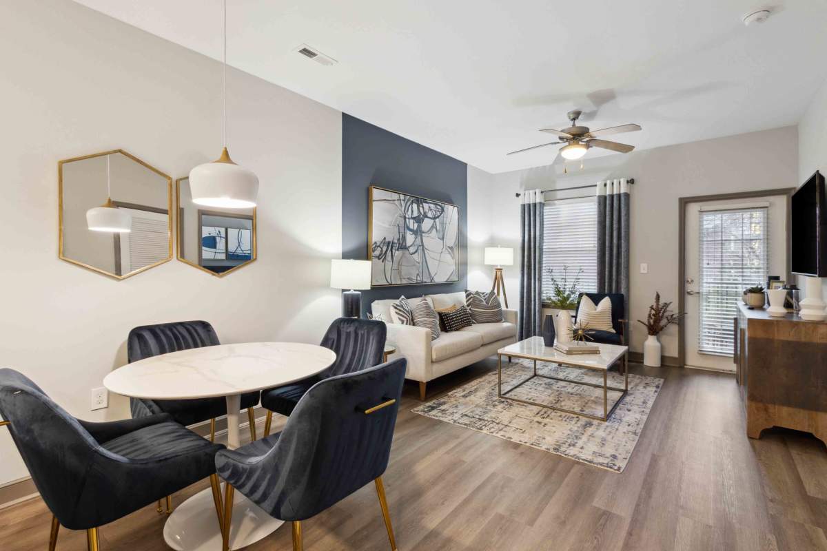 Living room with wood-style flooring at Sage at 1240 in Mount Pleasant, South Carolina