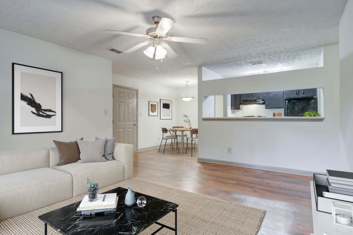 Wood-style flooring in a living room at Place at Midway in Douglasville, Georgia