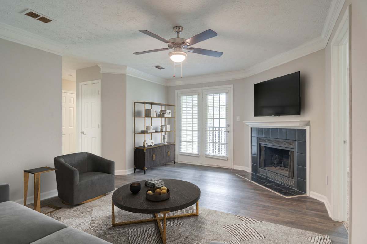 Living room with a fireplace at Place at Midway in Douglasville, Georgia