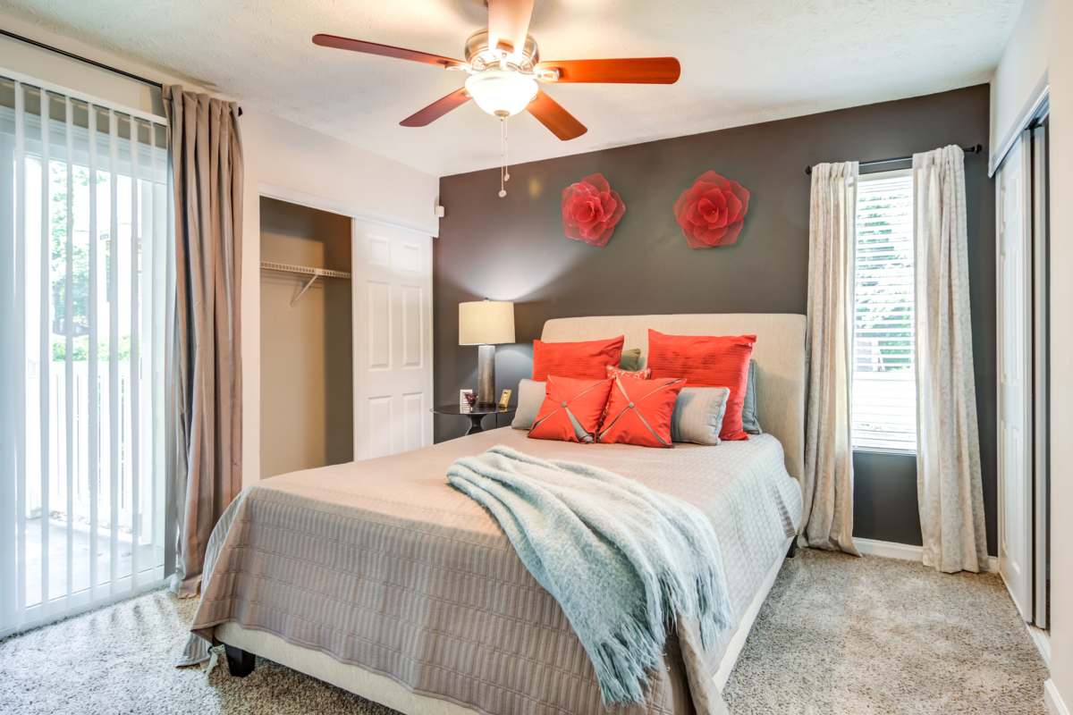 Bedroom with a ceiling fan at 2200 Big Creek Apartments in Roswell, Georgia