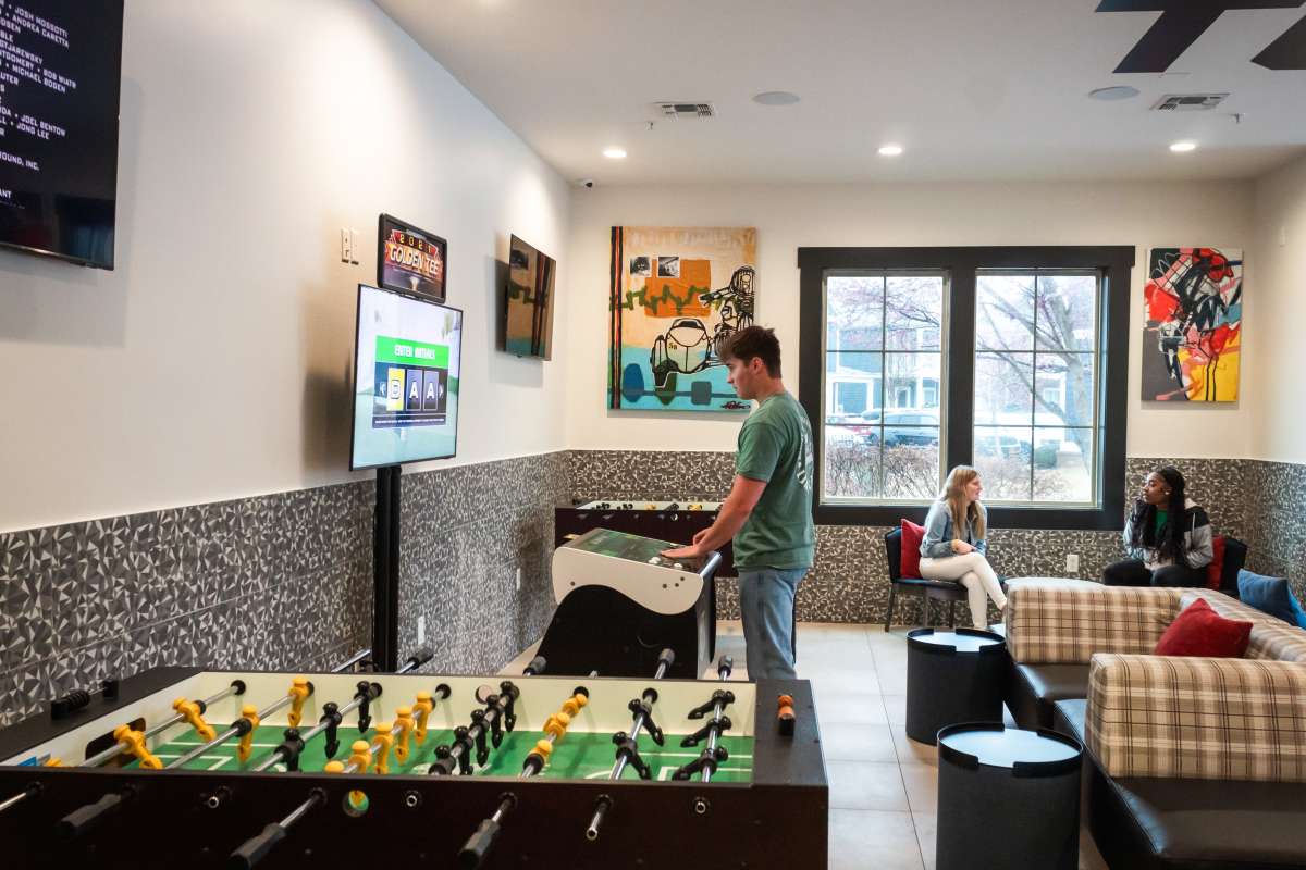 Resident in game lounge at College Town Oxford in Oxford, Mississippi