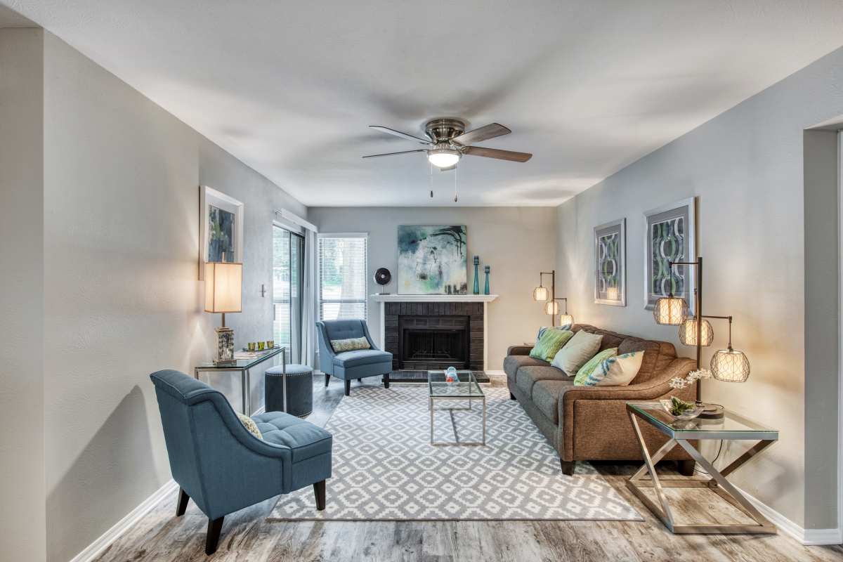 Resident living space with wood-style flooring at Lakes at Lincoln in Greensboro, North Carolina