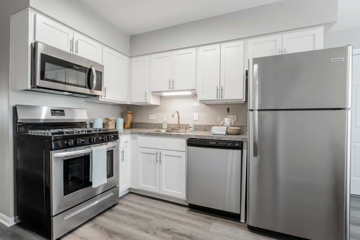 Model kitchen with stainless steel appliances at Courtyards on the Park in Des Plaines, Illinois