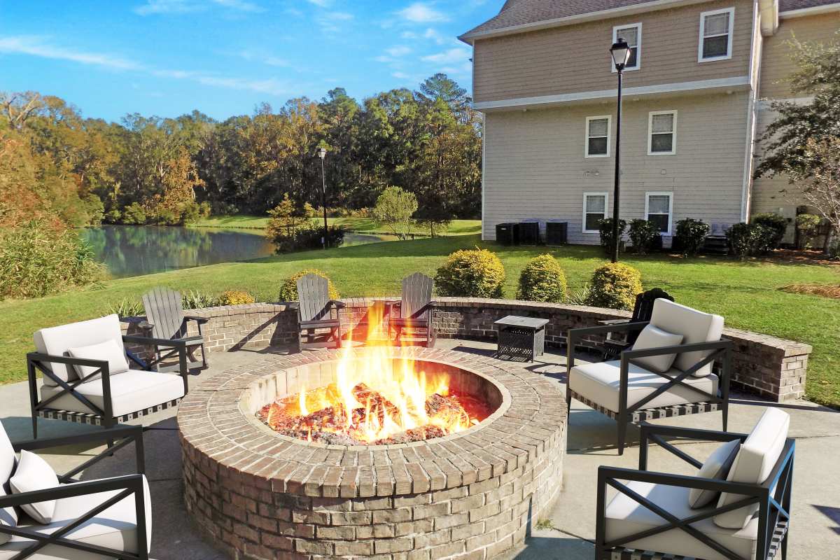 Outdoor fire pit with seating at Latitude at Richmond Hill in Richmond Hill, Georgia