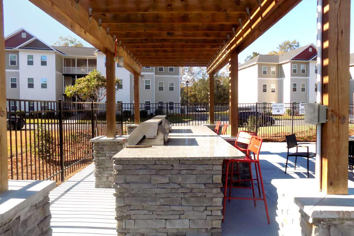 BBQ grilling pavilion with seating at Latitude at Richmond Hill in Richmond Hill, Georgia