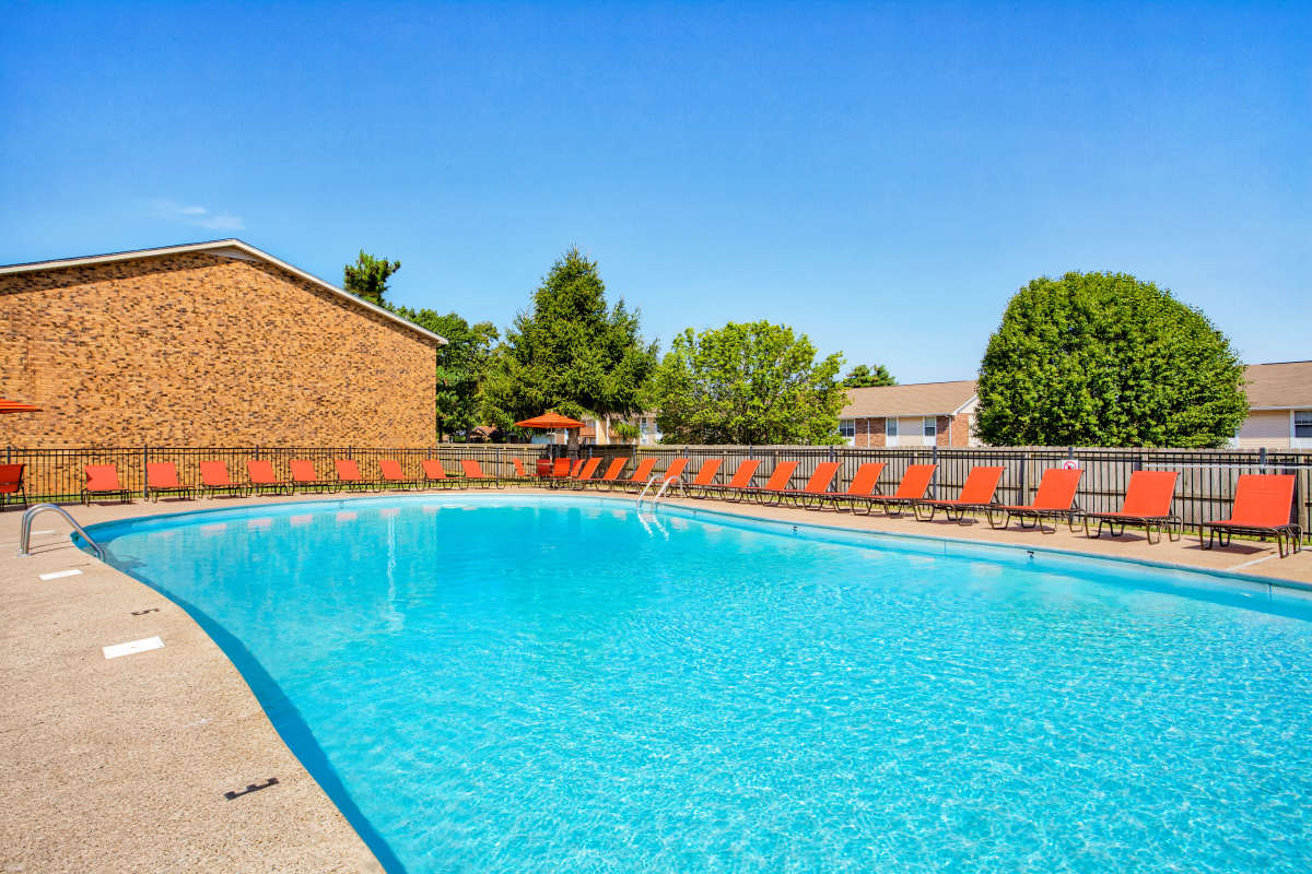 Refreshing swimming pool with lots of seating at Paddock Place and The Oaks in Clarksville, Tennessee