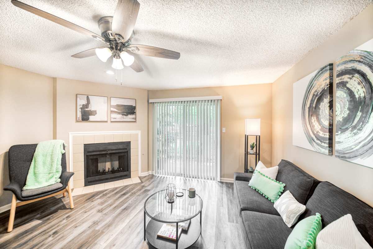 Model living space with wall art at The Willows at Shelby Farms in Cordova, Tennessee