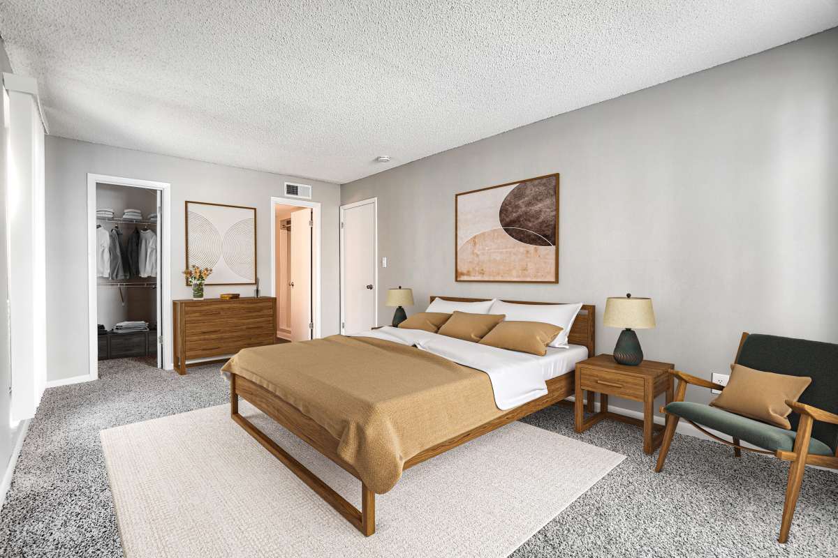 Model bedroom with plush carpeting at Royal Palms in Orlando, Florida
