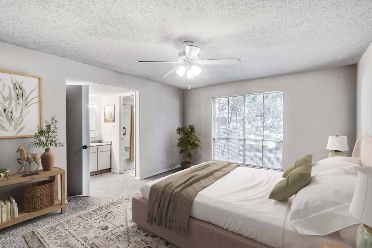 Master bedroom with a ceiling fan at Maison Imperial in Mobile, Alabama