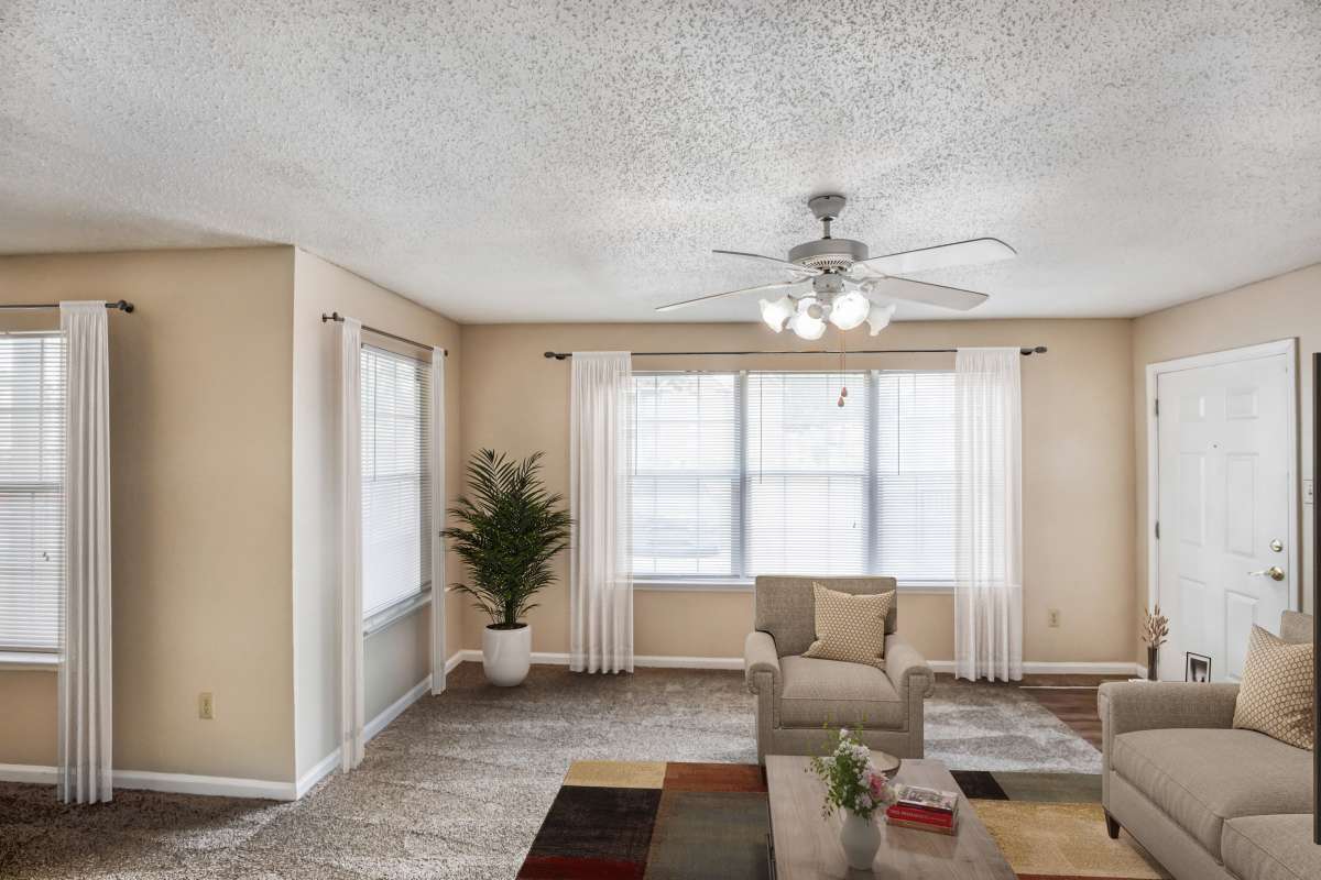 Resident living space with ceiling fan at Hidden Oaks at Siegen in Baton Rouge, Louisiana