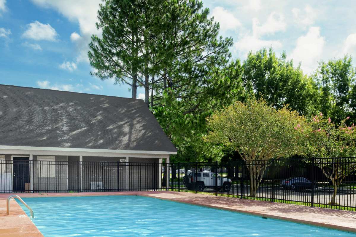 Refreshing community pool and greenery at Hidden Oaks at Siegen in Baton Rouge, Louisiana