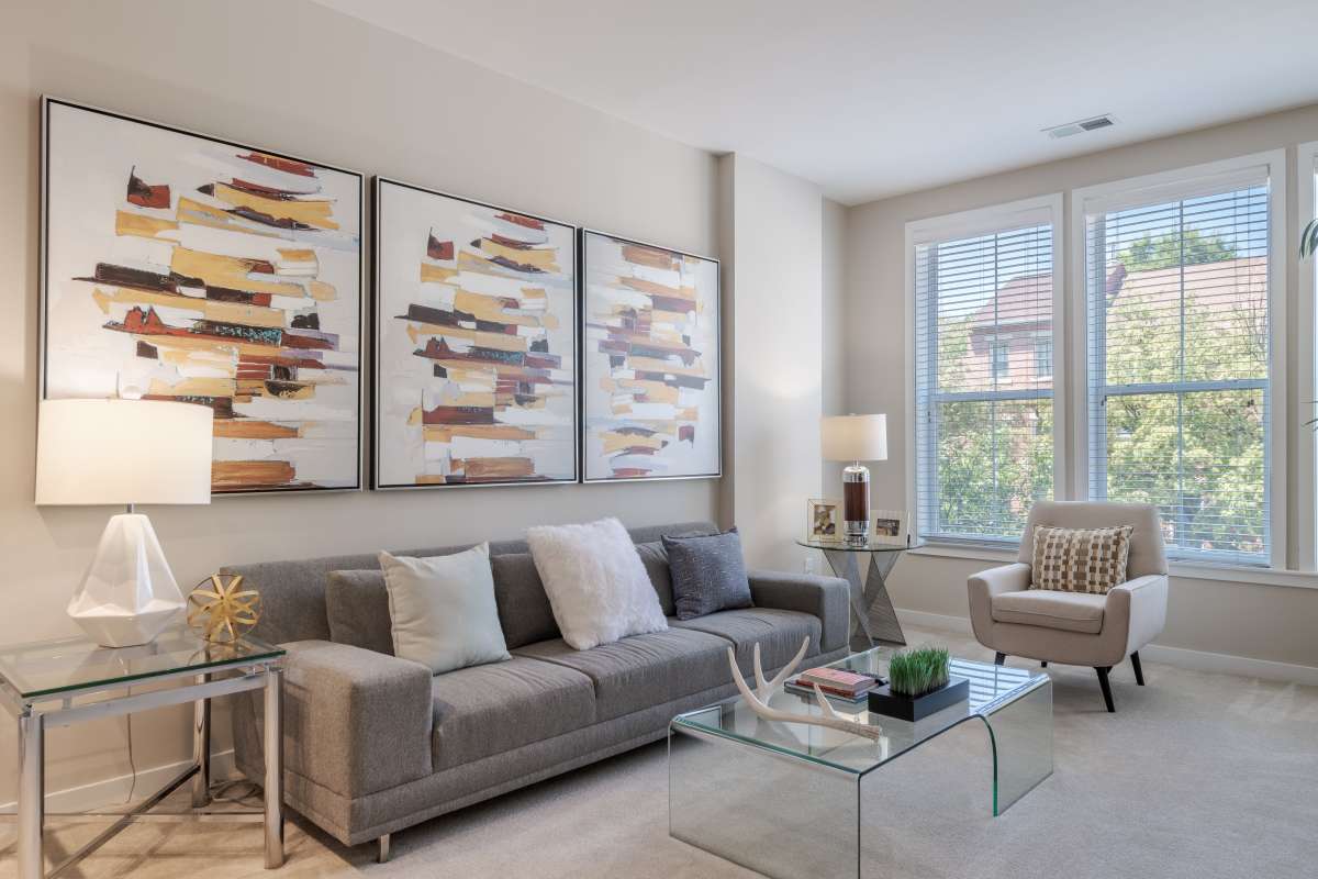 A living room with a couch and a coffee table at The Tala at Washington Hill in Baltimore, Maryland