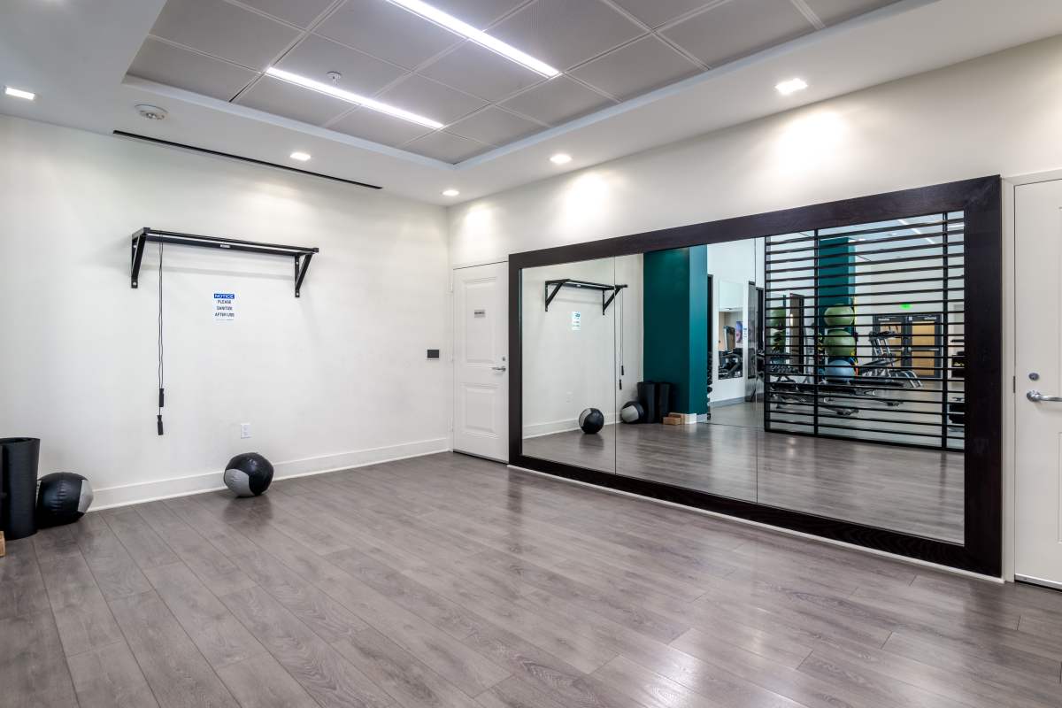 A room with a mirror and exercise balls at The Tala at Washington Hill in Baltimore, Maryland