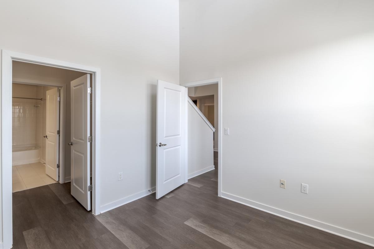 A room with white walls and doors at The Tala at Washington Hill in Baltimore, Maryland