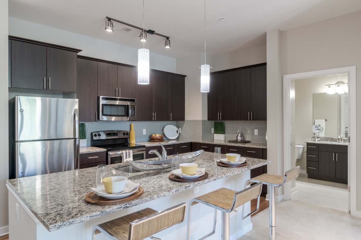 A kitchen with a large island at The Tala at Washington Hill in Baltimore, Maryland