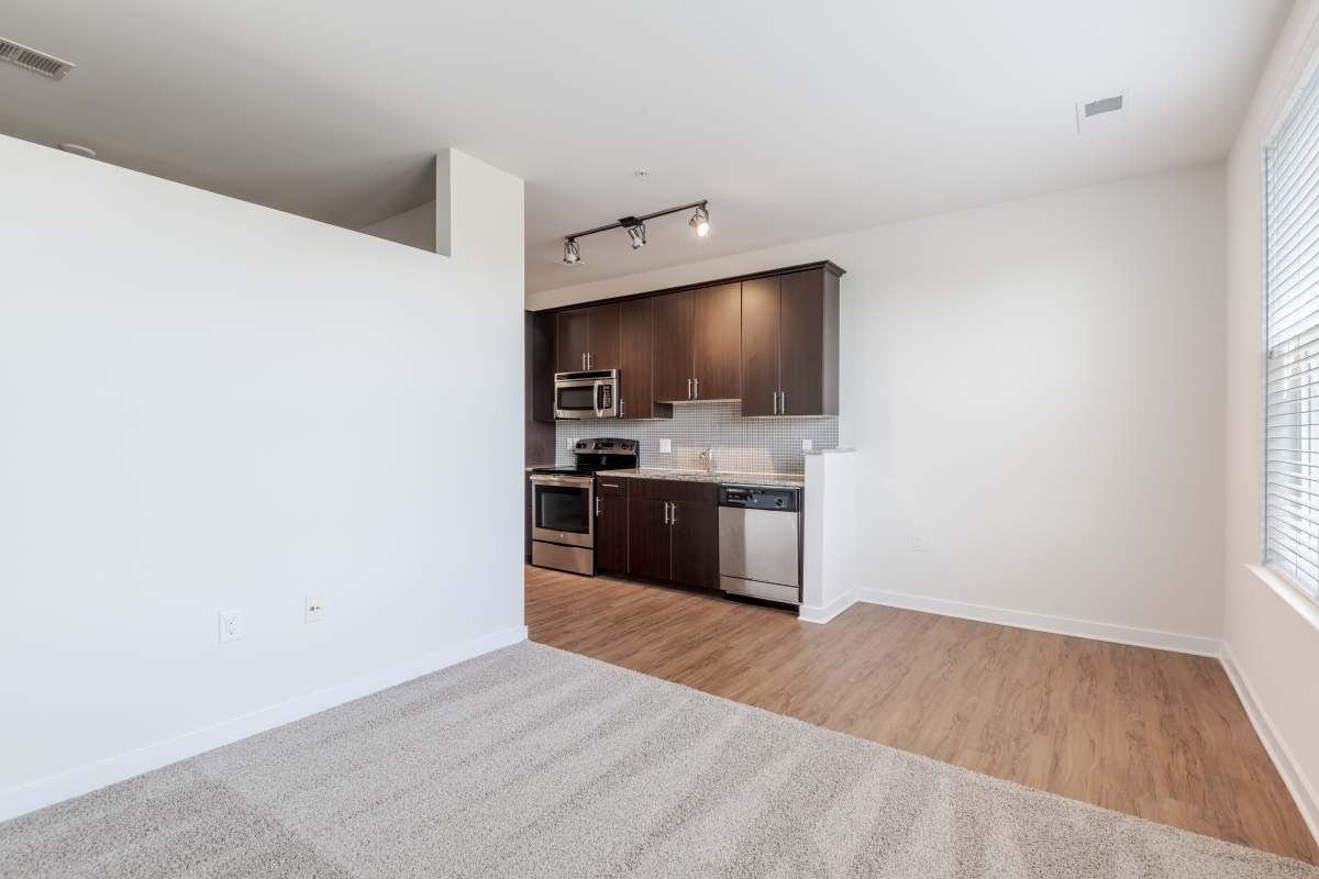 A room with a white wall and a white floor at The Tala at Washington Hill in Baltimore, Maryland