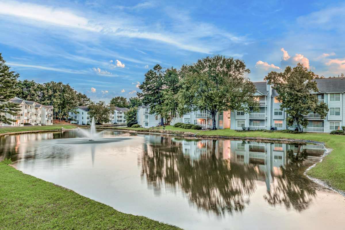 Well-landscaped community with lake and water feature at Trinity Lakes in Cordova, Tennessee