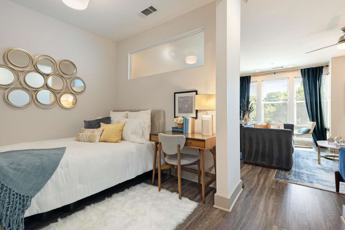 Bedroom with hardwood floors at The Dartmouth North Hills in Raleigh, North Carolina