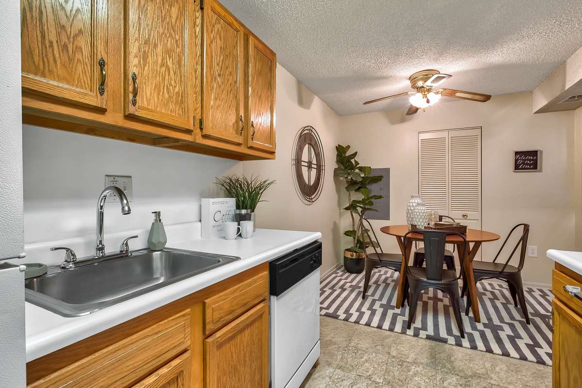 Resident kitchen with a dishwasher at The Pines in Harrisburg, Pennsylvania