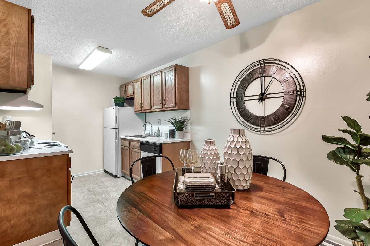 Resident dining area with a ceiling fan at The Pines in Harrisburg, Pennsylvania