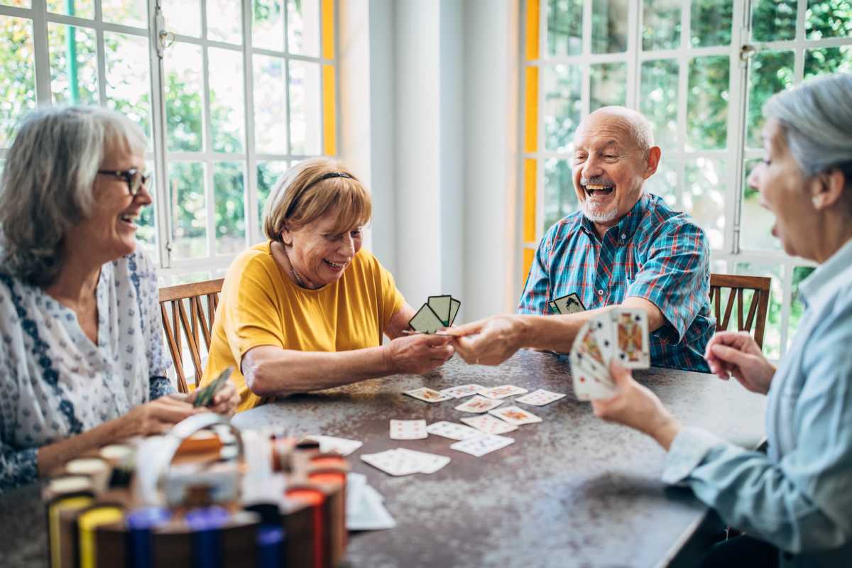 Residents playing cards at Hayloft Big Creek in Alpharetta, Georgia