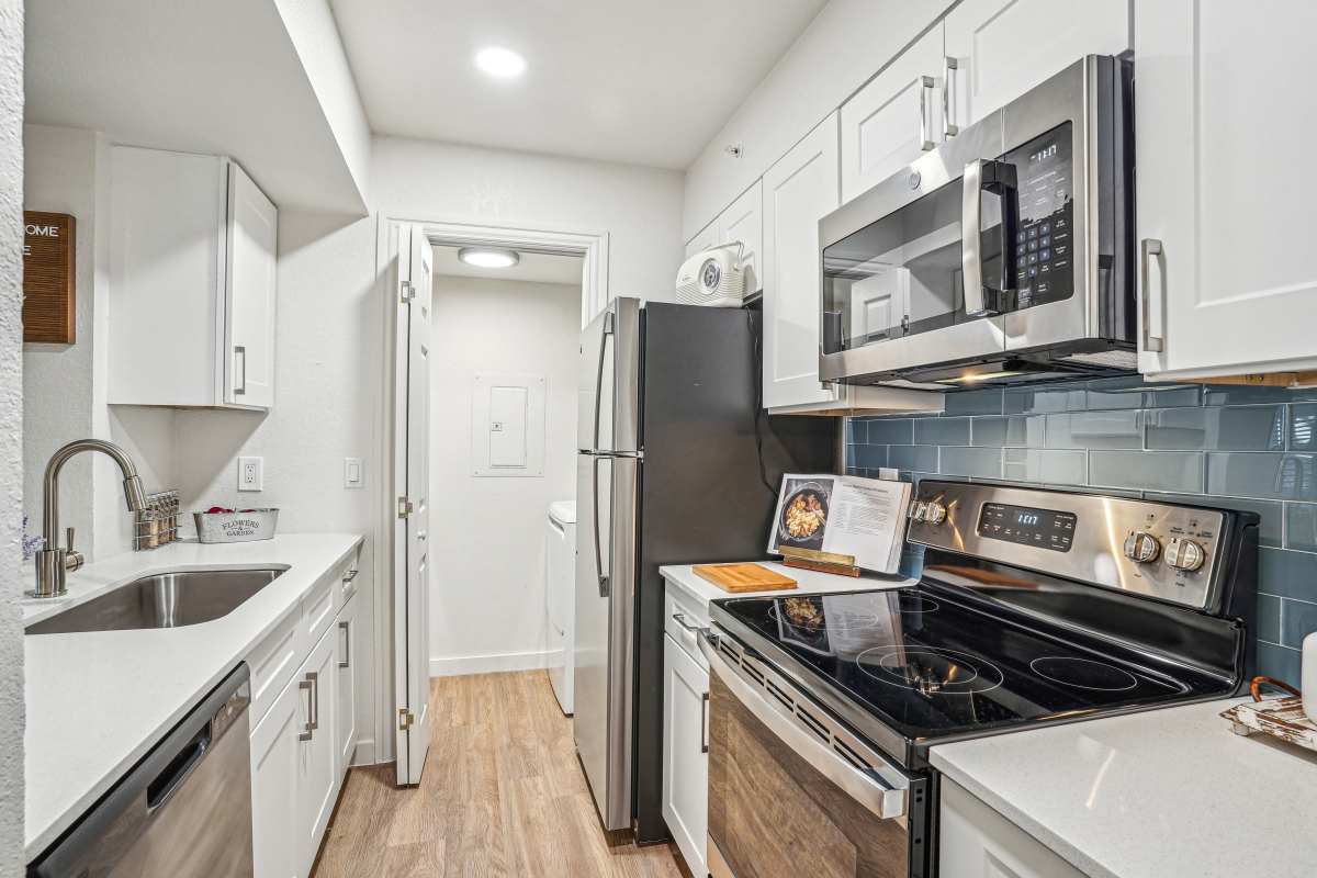 Modern kitchen with upgraded fixtures and hardware at The Rustic of McKinney in McKinney, Texas