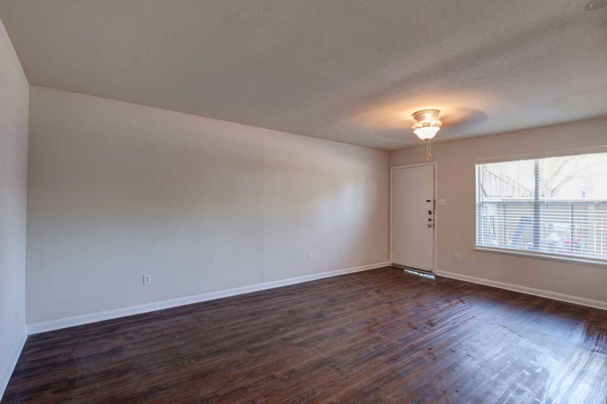 Bedroom with hardwood floors at Meyerland Court in Houston, Texas