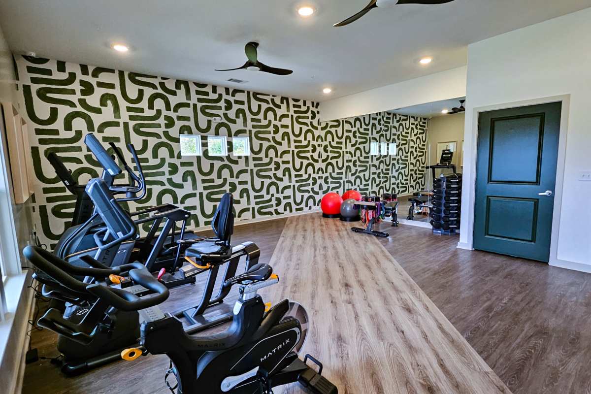 View community amenities like a full-equipped fitness center at Bridge Creek Pointe in Spartanburg, South Carolina