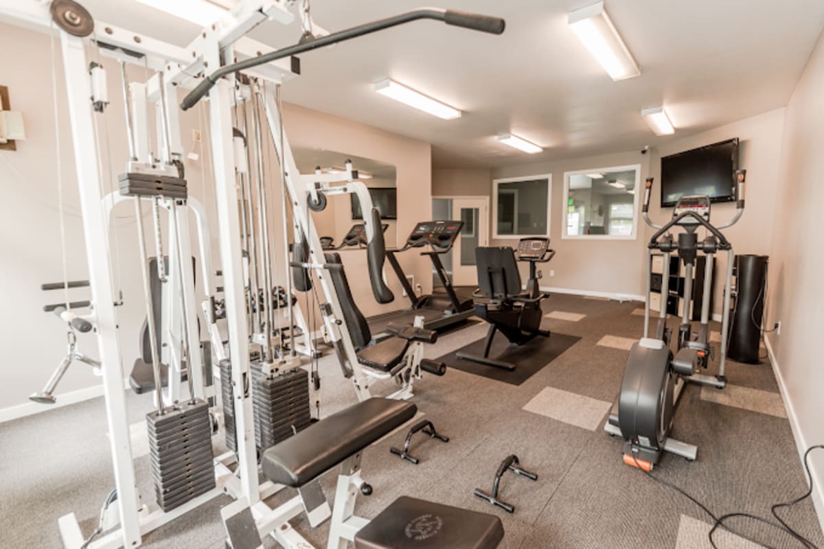 Fitness studio with treadmills and weight machines at Briarstone in Tacoma, Washington