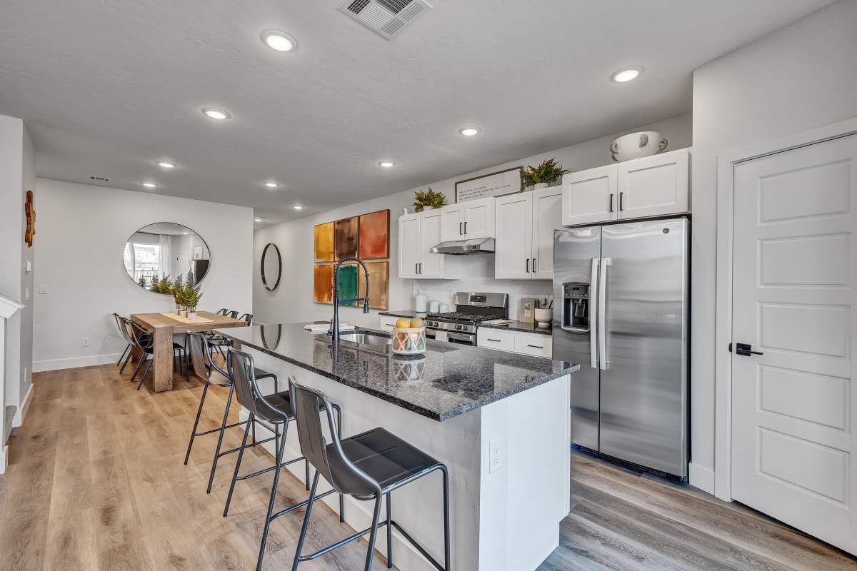 Kitchen featuring upgraded appliances and granite countertops at BB Living at The Oaks in Meridian, Idaho
