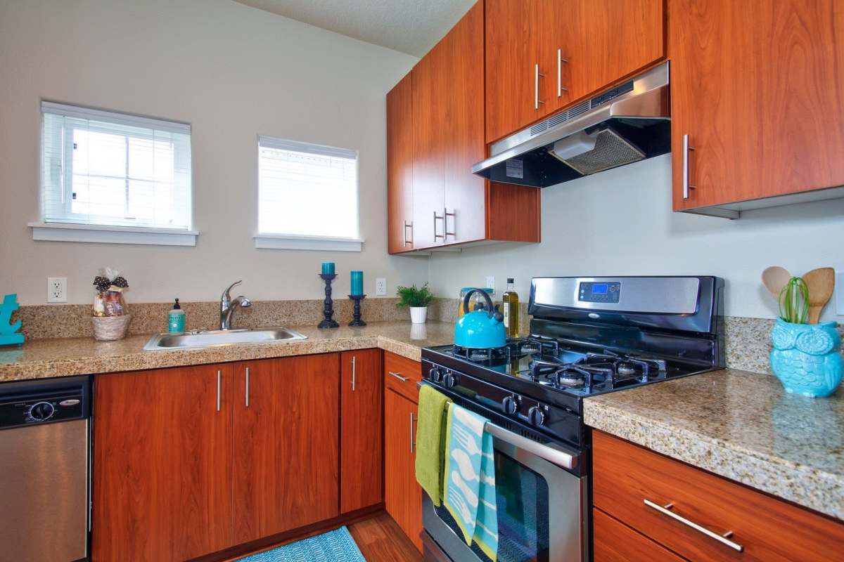 Fully equipped kitchenwith wood cabinetry at Sunset Crossing in Beaverton, Oregon,