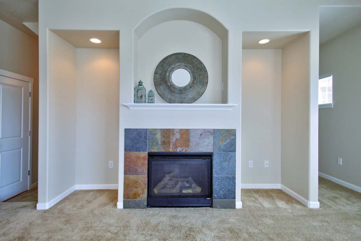 Living room with fireplace at Sunset Crossing in Beaverton, Oregon,