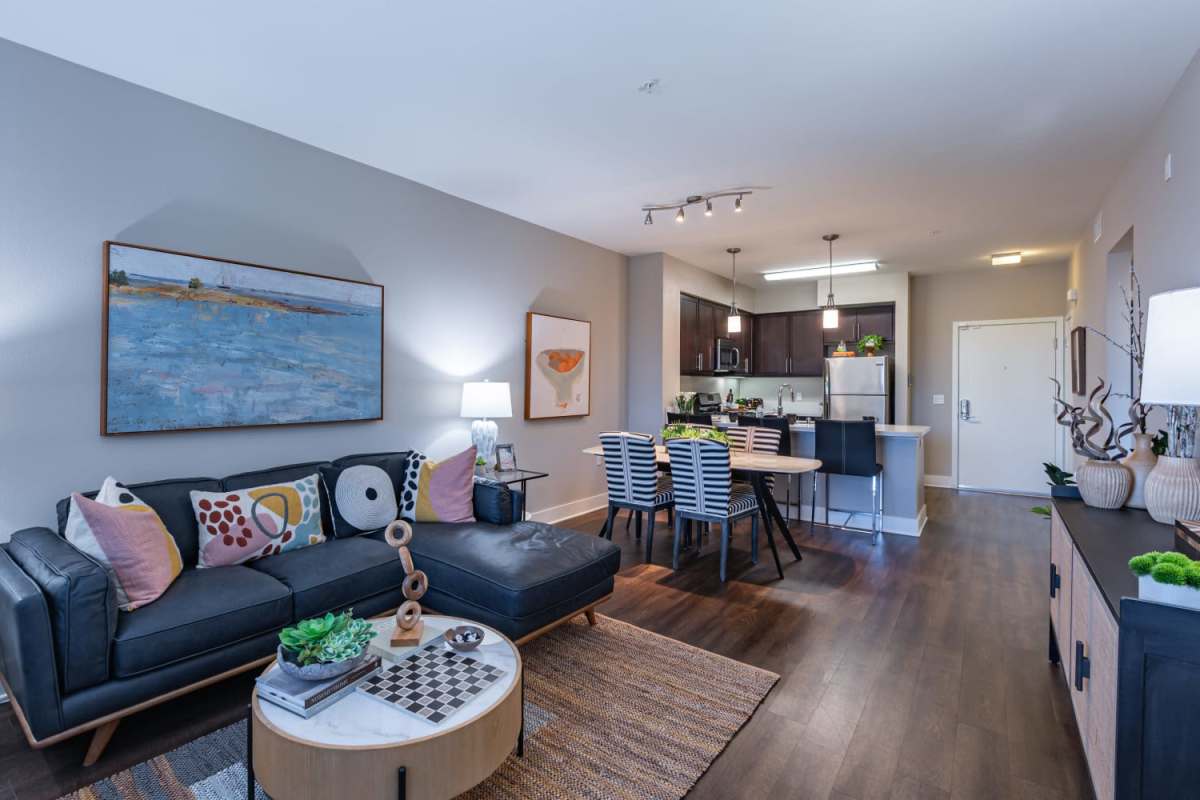 Living room with center table at The Boulevard Apartment Homes in Woodland Hills, California