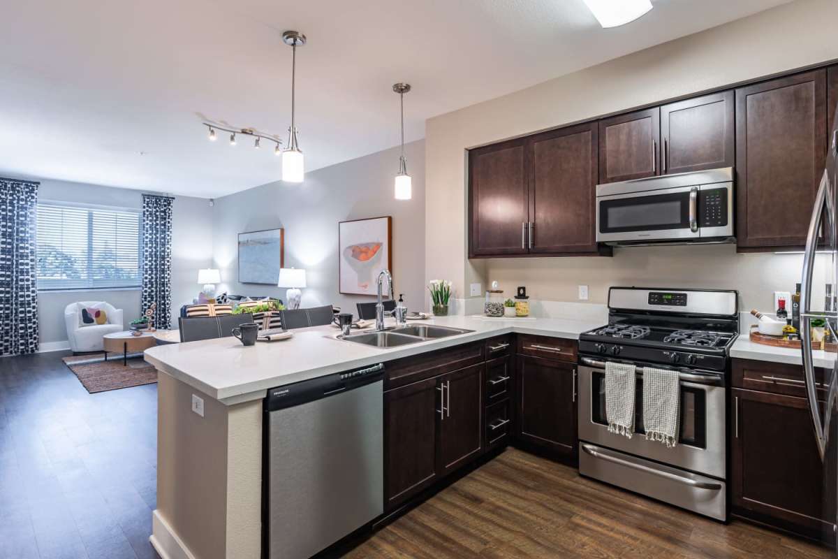 Kitchen with view to living room at The Boulevard Apartment Homes in Woodland Hills, California