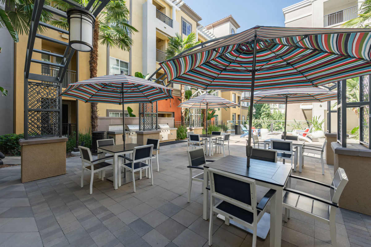 Outside courtyard area with grilling station at The Boulevard Apartment Homes in Woodland Hills, California
