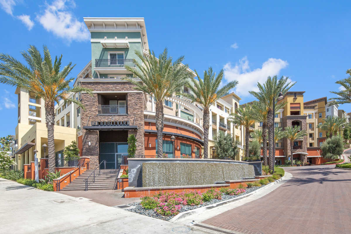 Community exterior view with entrance at The Boulevard Apartment Homes in Woodland Hills, California