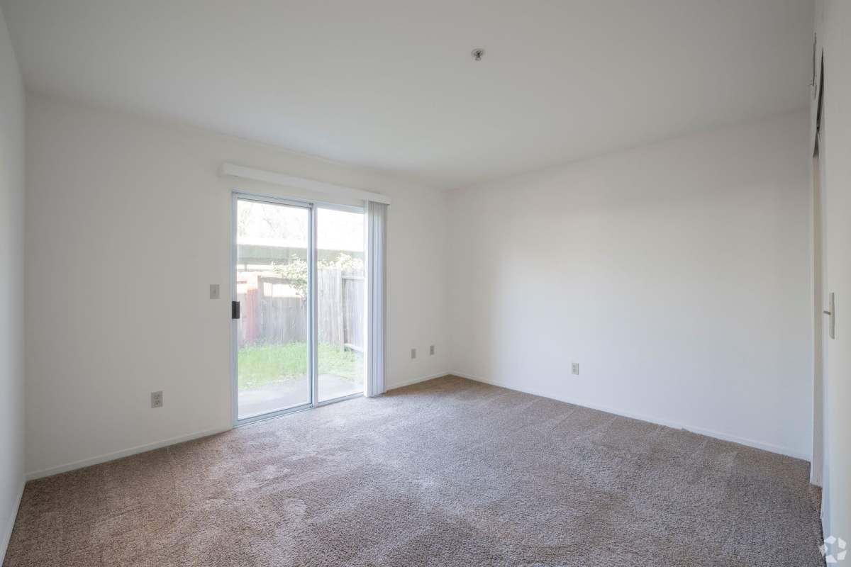 Bedroom with doors to backyard at Cadillac Flats in Napa, California