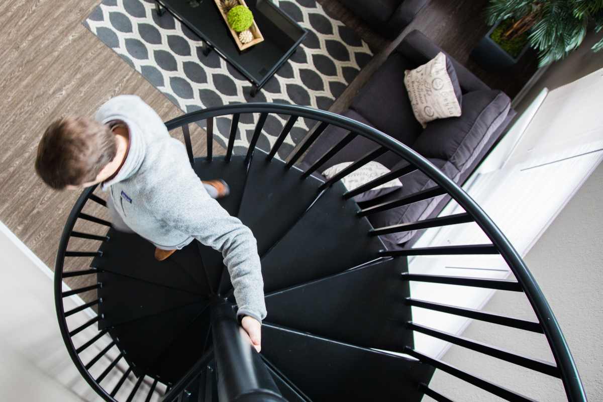 Student getting down the stairs at Brookside Downtown in Columbia, Missouri, 