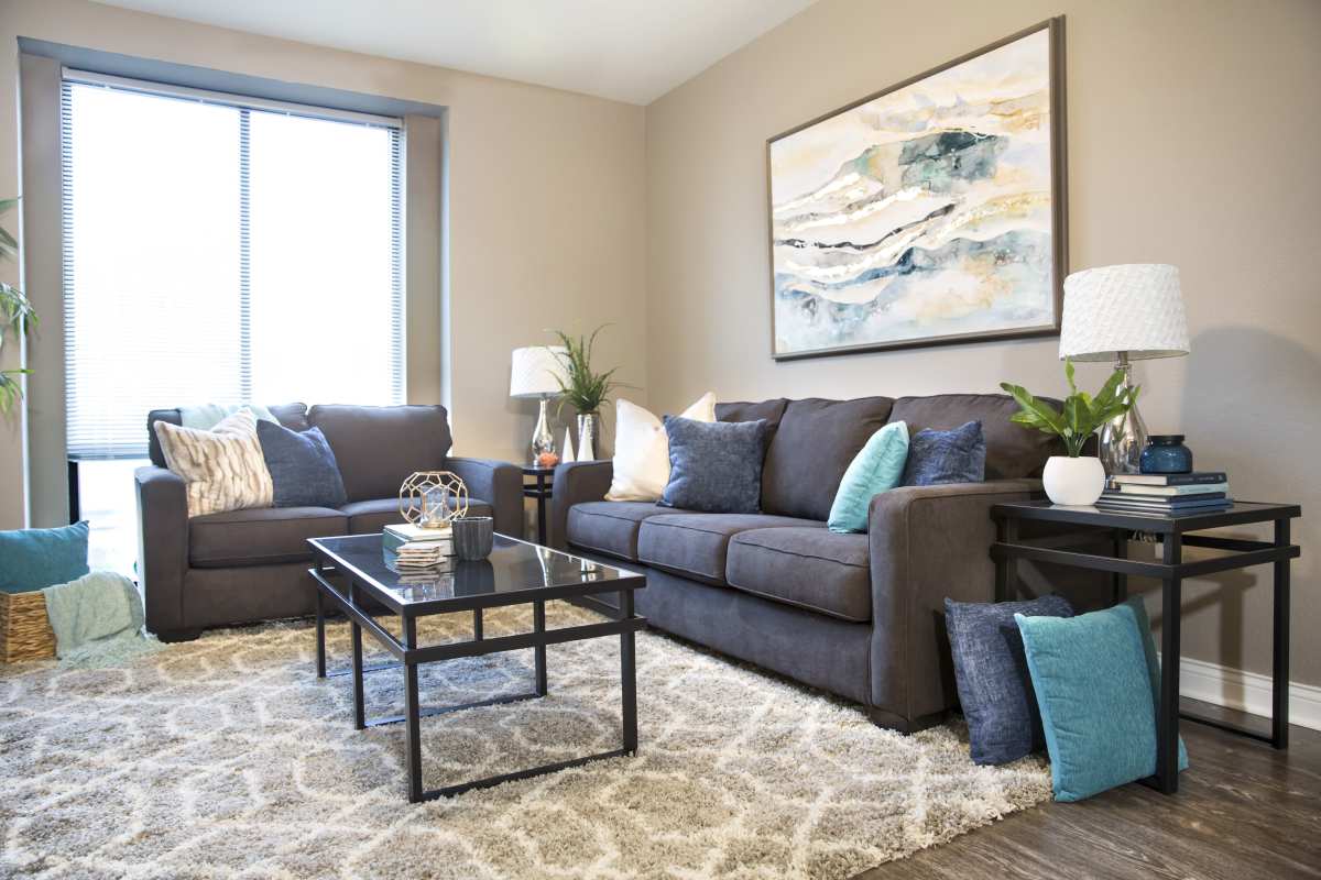 Bright living room with large windows at Brookside Downtown in Columbia, Missouri, 