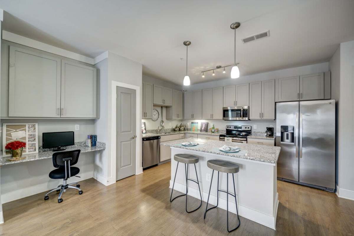 Kithchen area with island bar and a working space at Century Park Place in Morrisville, North Carolina
