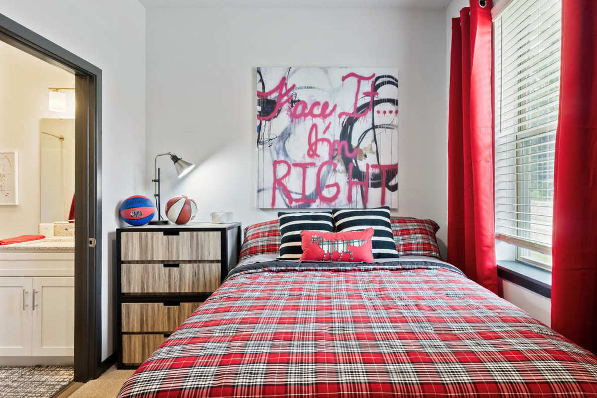 Cozy bedroom area with a bed at Atlas on 17th in Bloomington Indiana