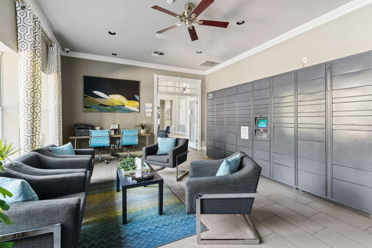 Modern Lounge Area With Package Lockers And Seating at Whispering Creek Villas, San Antonio, Texas