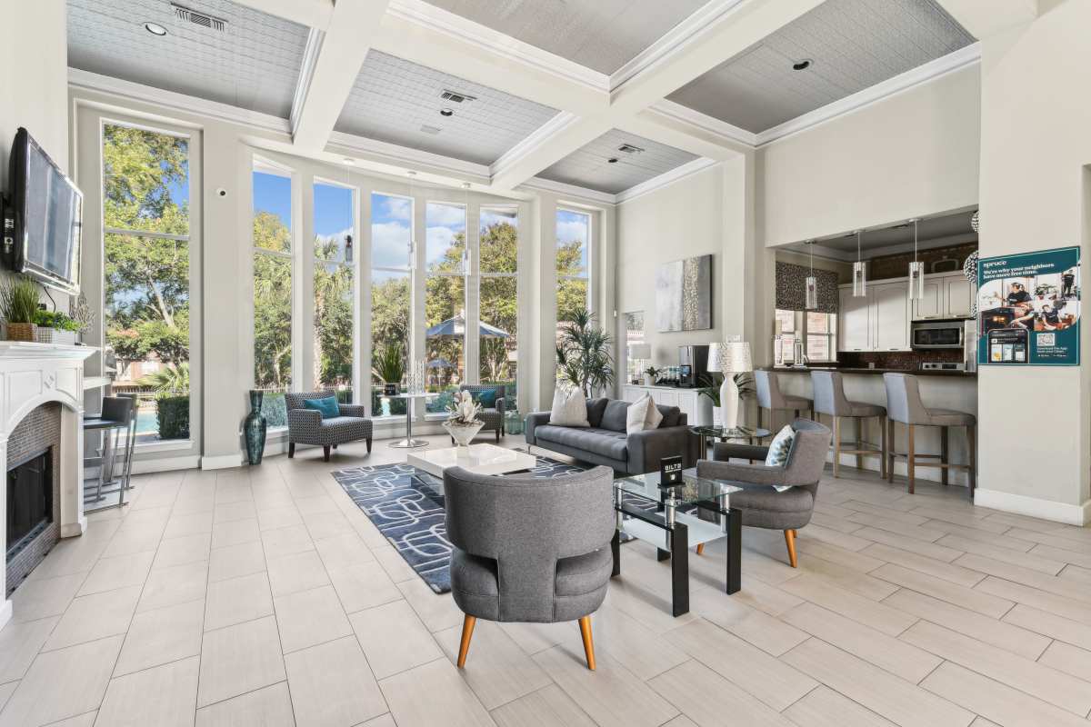 Luxurious Lounge Area With High Ceilings And Large Windows at Whispering Creek Villas, San Antonio, Texas