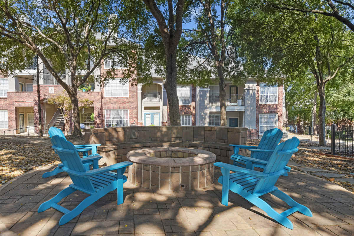 Outdoor Fire Pit With Blue Adirondack Chairs at Whispering Creek Villas, San Antonio, Texas