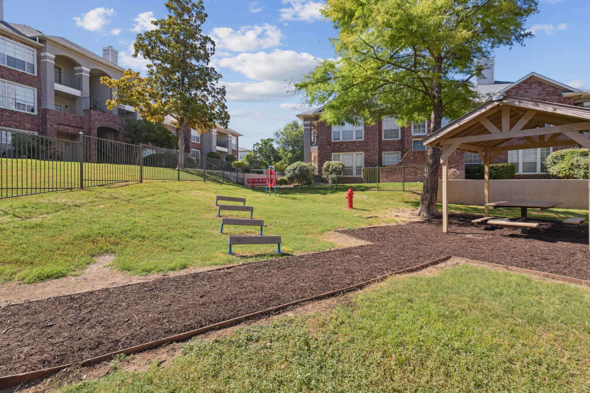 Community Park Area With A Picnic Shelter And Play Equipment at Whispering Creek Villas, San Antonio, Texas