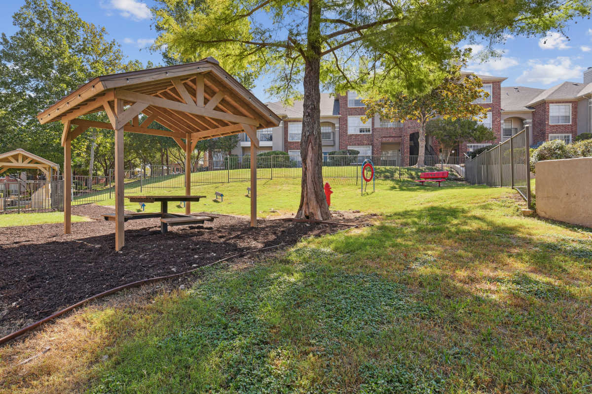 Shaded Picnic Area In A Grassy Park at Whispering Creek Villas, San Antonio, Texas
