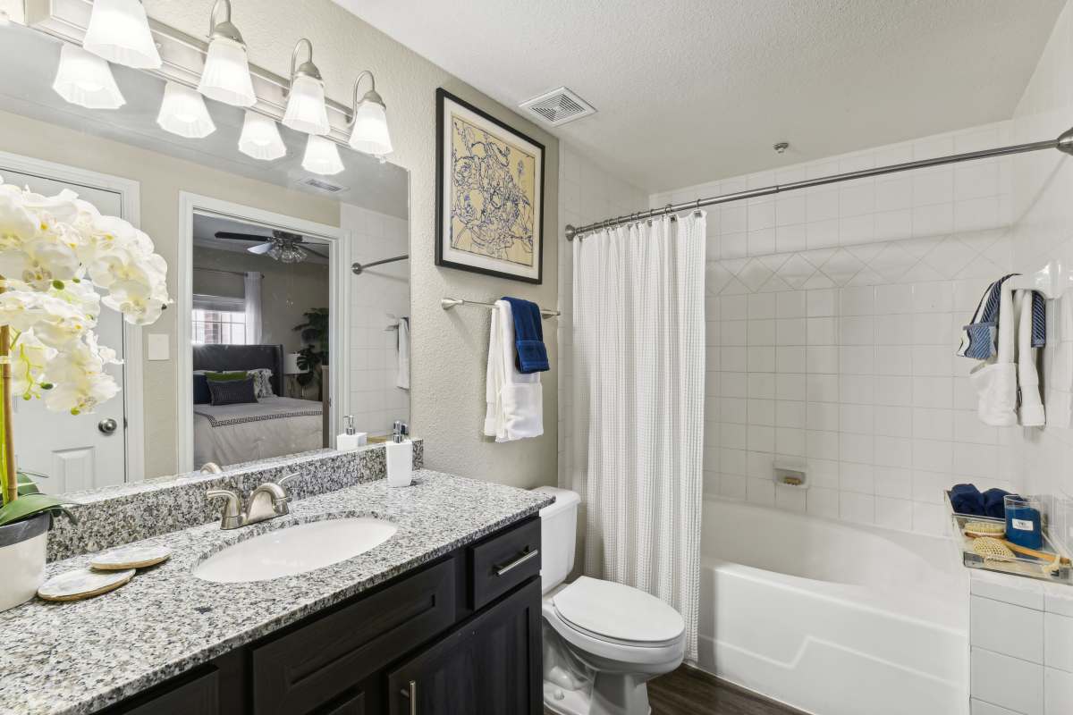 Full Bathroom With A Bathtub, Shower, And A Vanity Sink at Whispering Creek Villas, San Antonio, Texas