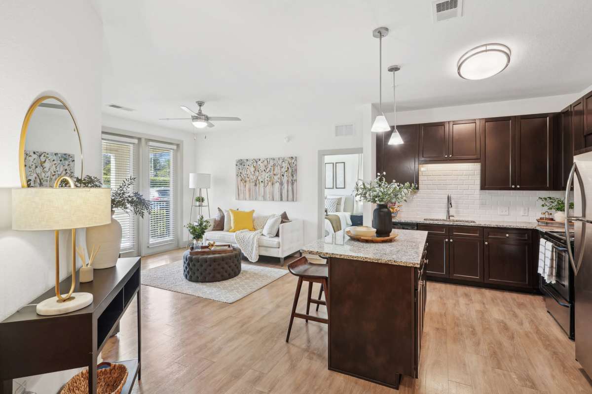 Combined view of the living room and the kitchen at Millennium in Fort Myers, Florida