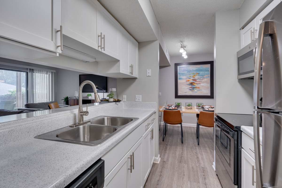 Kitchen with stainless-steel appliances at The Retreat at Lake Johnson Apartments, Raleigh, North Carolina